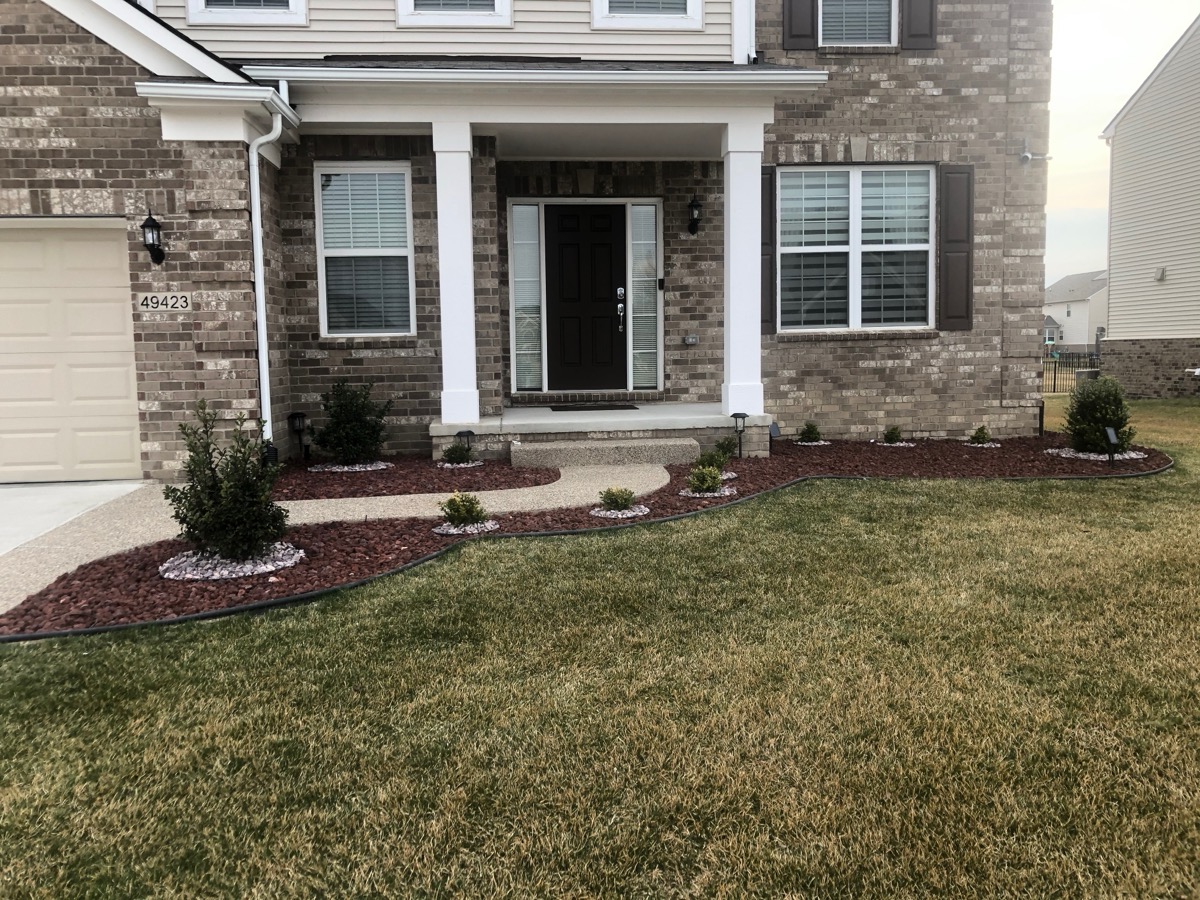 Front Yard Rock Bed & Shrubs